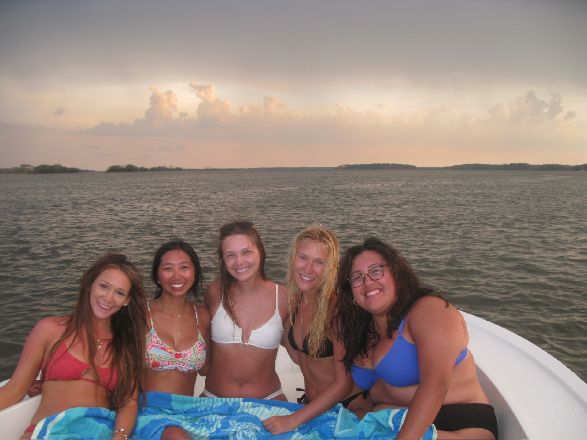Guests aboard the Money Makin' Mako at sunset on the water