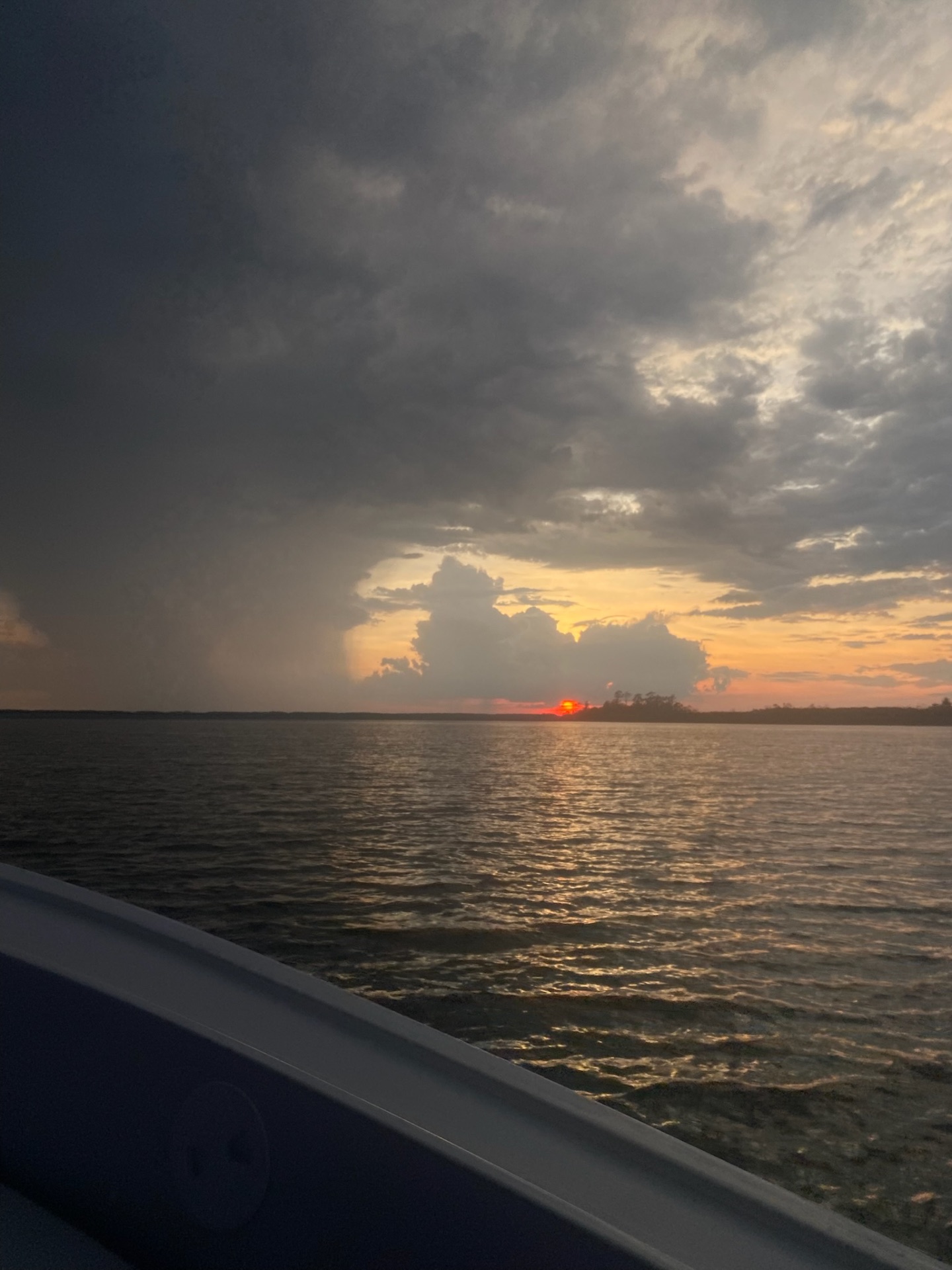 Sunset over the Lowcountry water seen from the rail of the Money Makin' Mako